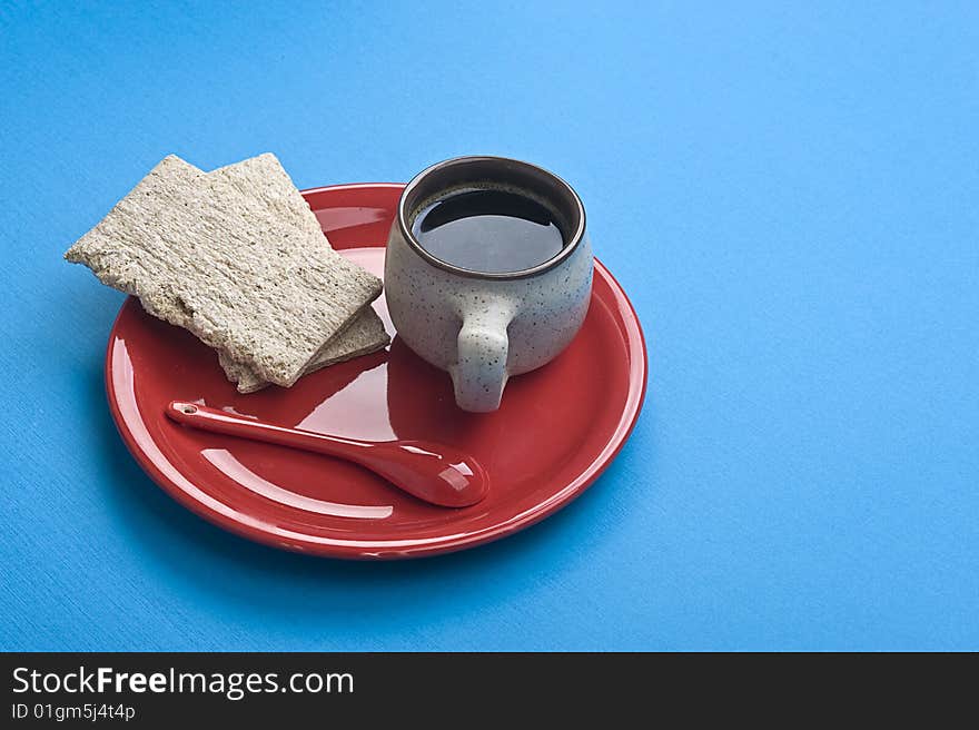 Breakfast. Coffee cup and toasts on blue table. Many lot of copyspace