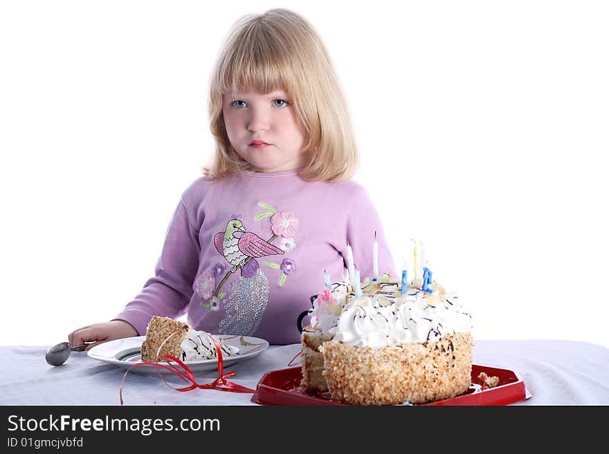 Disaffected girl with birthday cake isolated on white. Disaffected girl with birthday cake isolated on white