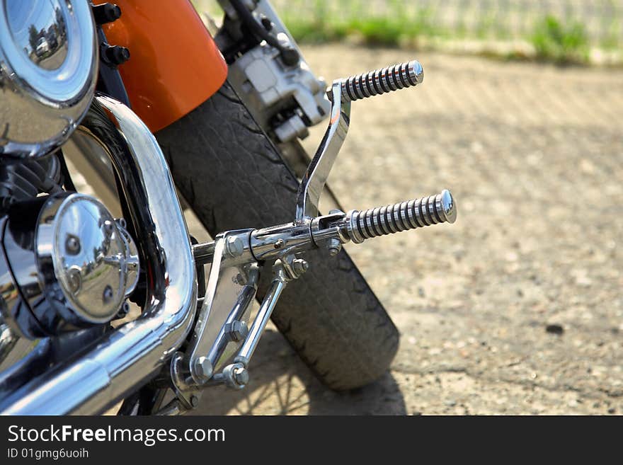 Motorcycle details: wheel, motor and exhaust