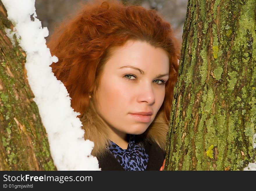 Portrait of the young beautiful woman with red hair. Portrait of the young beautiful woman with red hair