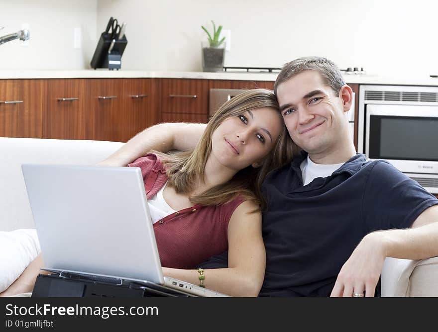 Attractive young couple in a fresh, modern home. Attractive young couple in a fresh, modern home.