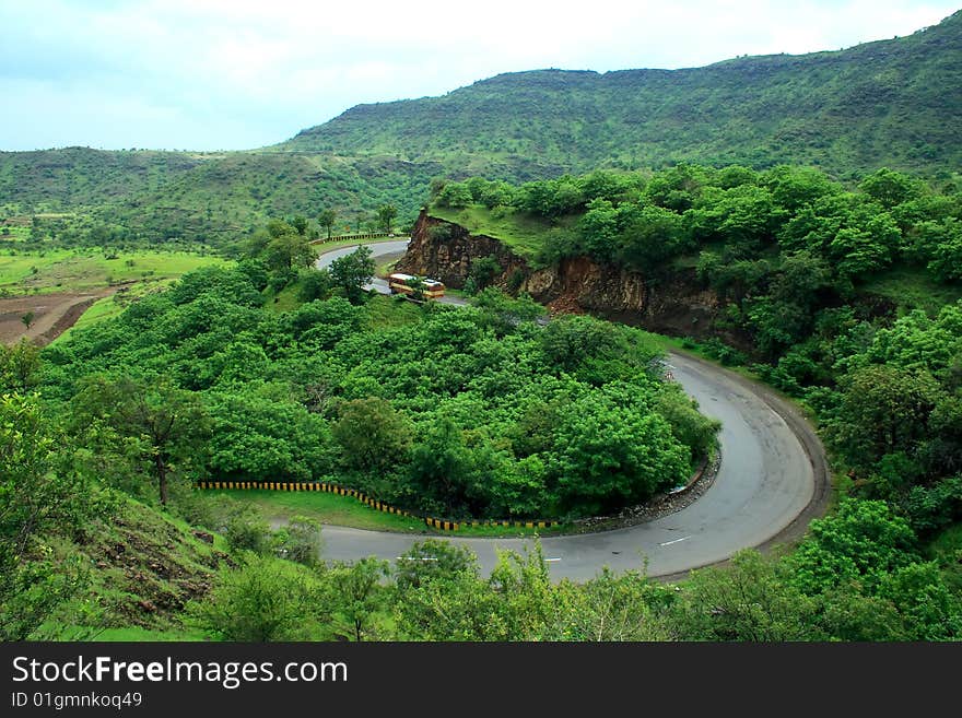 A majestic and picturesque express highway turn in a Indian village. A majestic and picturesque express highway turn in a Indian village.