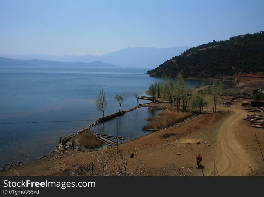 Ugu lake belong  lijiang old town ,yunnan province .many hotels built here for travelers.mosuo people live in the lugu lake,The walking marriage widely adopted by the Mosuo people of China is a unique marriage custom that is deeply related to its social and cultural traditions of the matrilineal family system. In a walking marriage, the couples do not marry to each other and both stay in their own matrilineal family for their whole life. The marriage and propagation of offspring is realized through walking by male. The women open their doors to their lovers every evening, and the men walk home to work in their mother's household every morning. Neither of them is a member of each other's family. The woman and man in this relationship call each other A-xia, which means lovers in the sense of husband