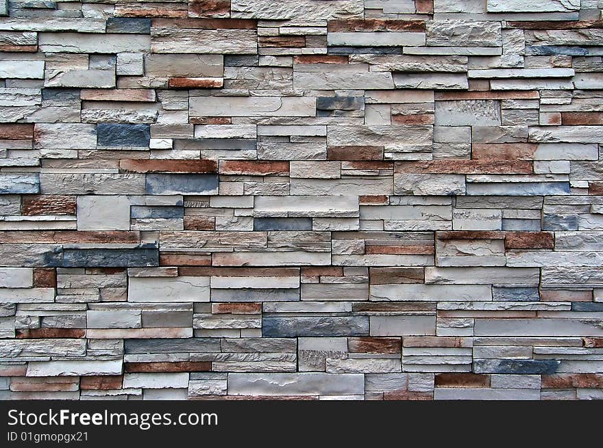 A great texture of a wall with various sized bricks. Mainly white, red, and blue. A great texture of a wall with various sized bricks. Mainly white, red, and blue.