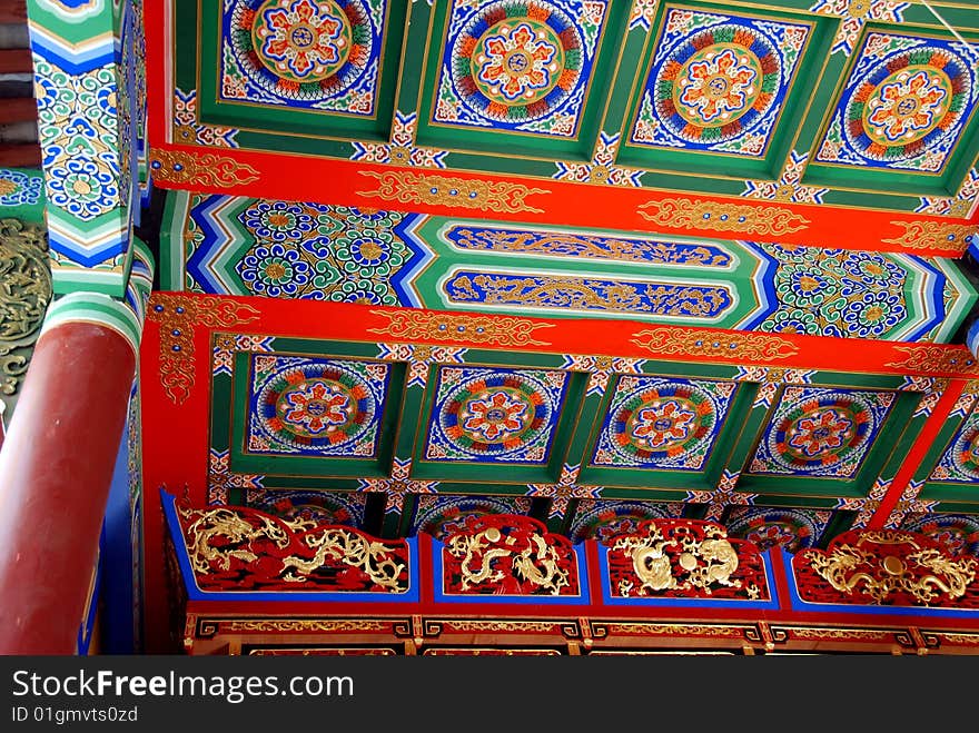 Extraordinary painted ceiling in traditional red, green, and blue colours in the entrance pavilion to the centuries-old Long Xing Temple in Pengzhou, Sichuan province, China - Lee Snider Photo. Extraordinary painted ceiling in traditional red, green, and blue colours in the entrance pavilion to the centuries-old Long Xing Temple in Pengzhou, Sichuan province, China - Lee Snider Photo.