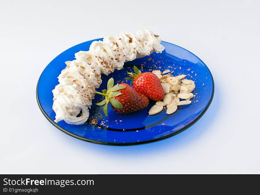 Strawberry banana dessert with cream and almonds. Strawberry banana dessert with cream and almonds