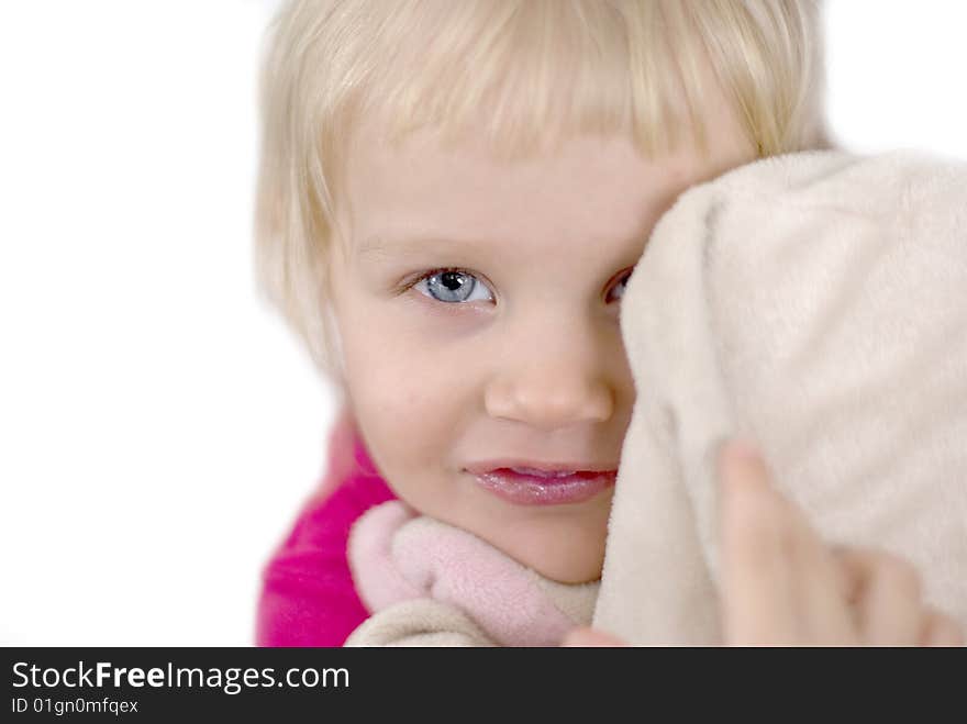 Little girl in a pink dress in hands a toy pig favourite. Little girl in a pink dress in hands a toy pig favourite