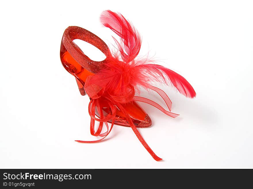 Red crystal slippers with feathers, isolated on white