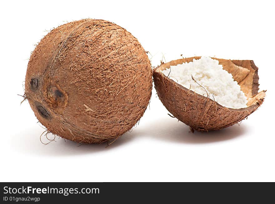 Half part of coconut with powder inside shell isolated on a white background. Half part of coconut with powder inside shell isolated on a white background.