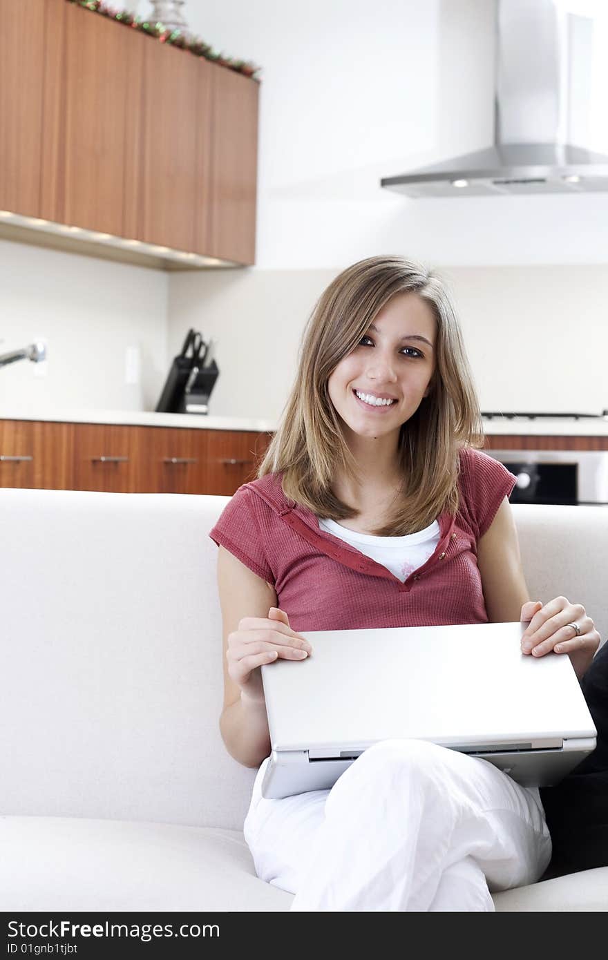 Relaxed young woman closing a laptop. Relaxed young woman closing a laptop.