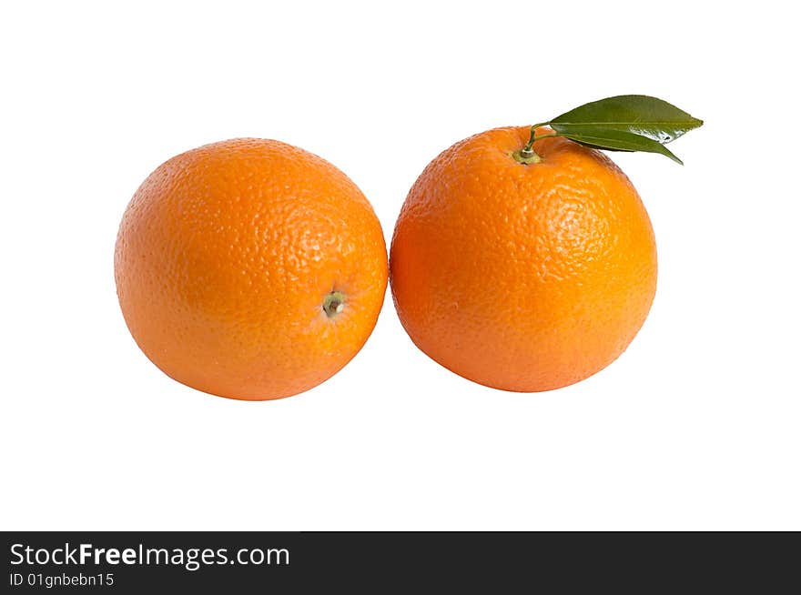 Two ripe oranges on a white.