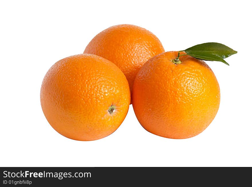 Ripe oranges and green leaves isolated on a white background. Ripe oranges and green leaves isolated on a white background.