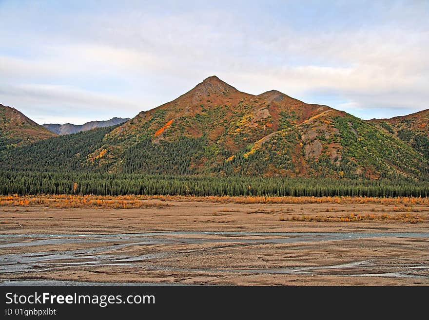 Glacier bed in Alaska with running water.