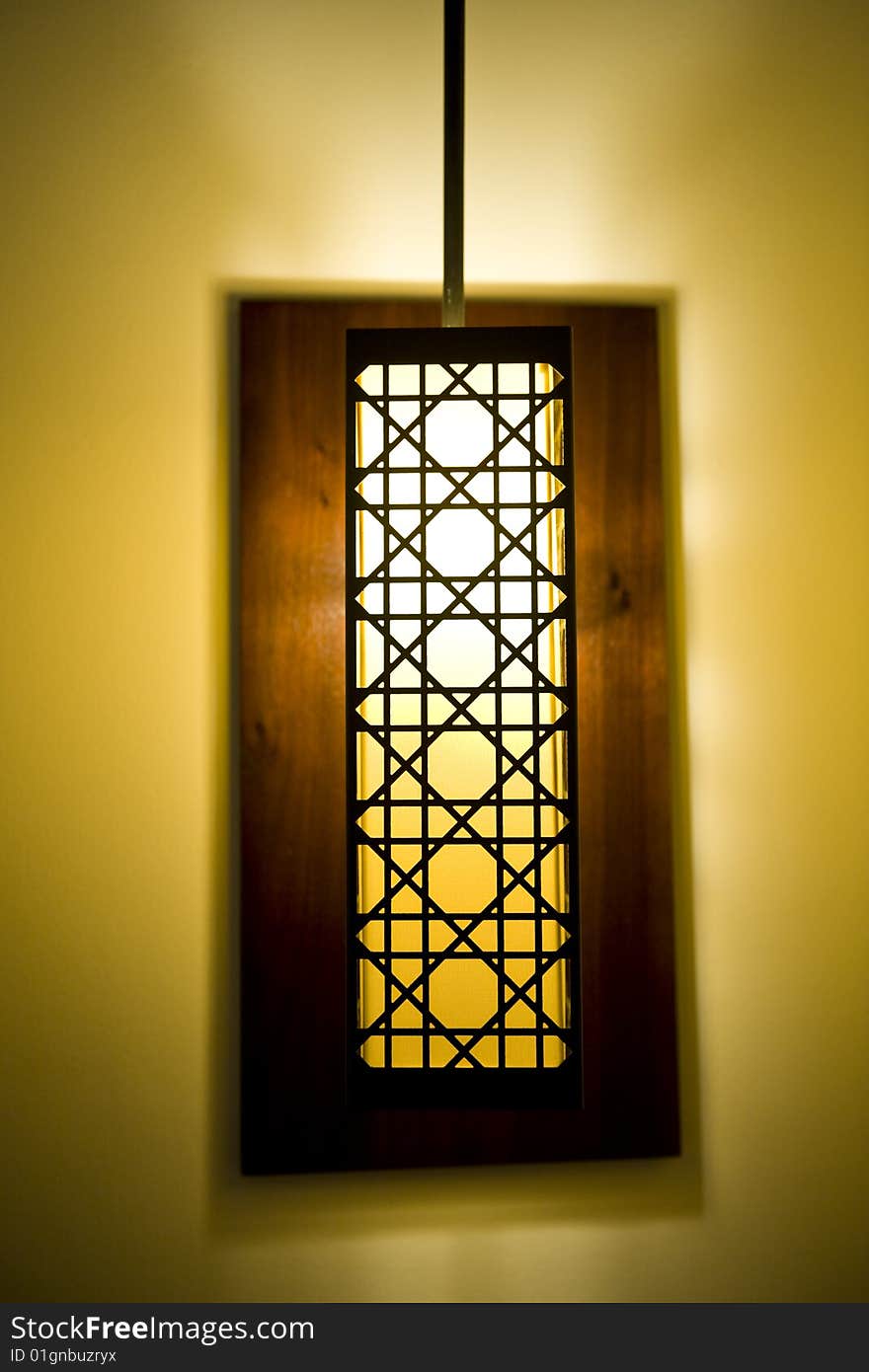 A decorative lamp shade in a luxurious hotel room.