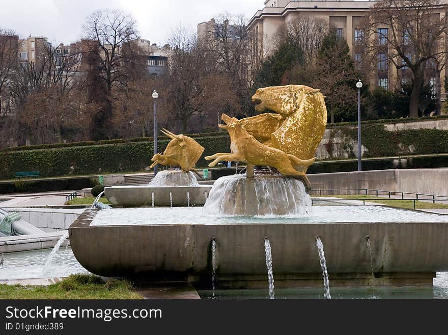 A fountain in the steps towards the eiffel tower. A fountain in the steps towards the eiffel tower