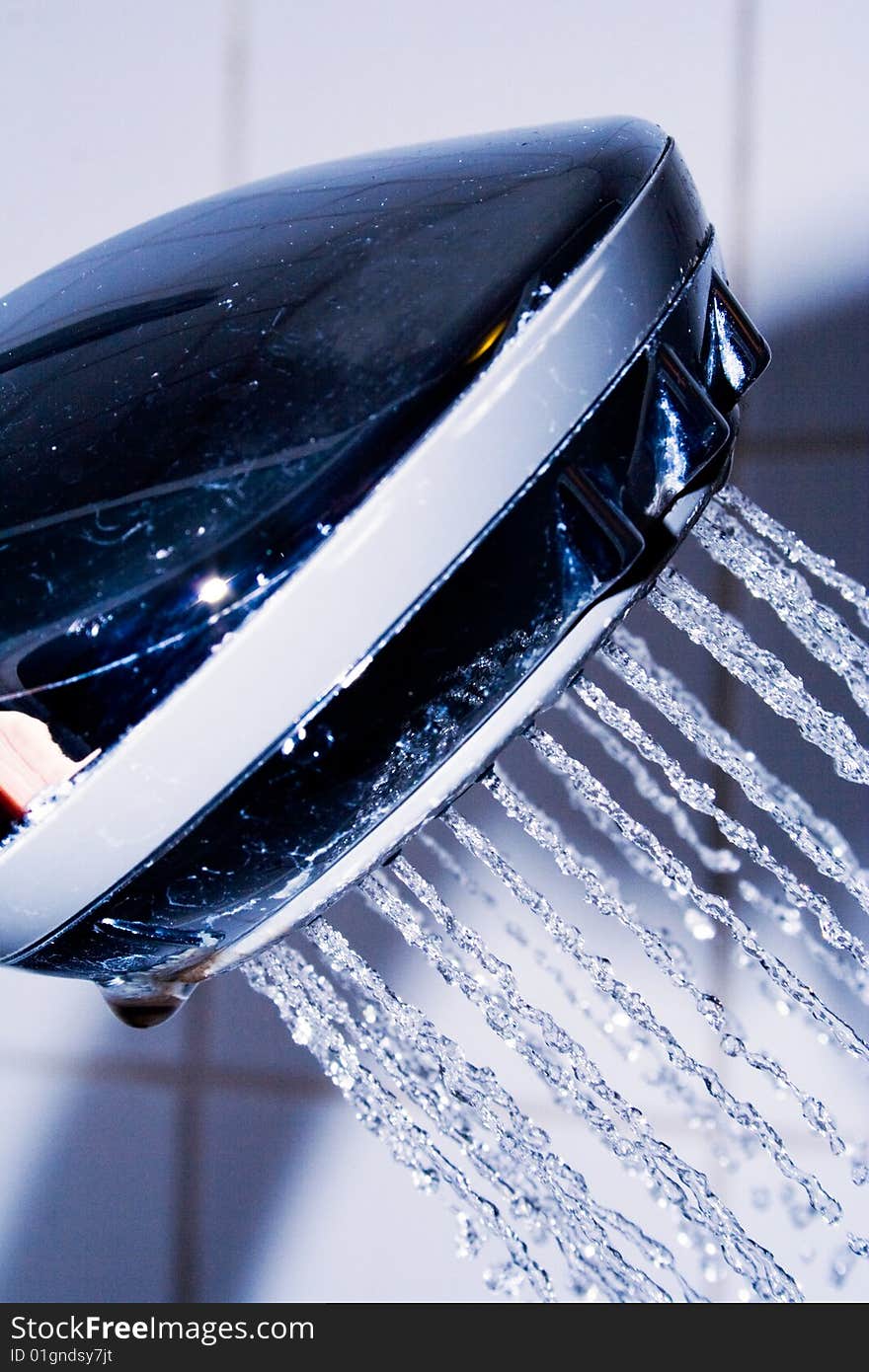 Detail of shower head with water spray. Detail of shower head with water spray