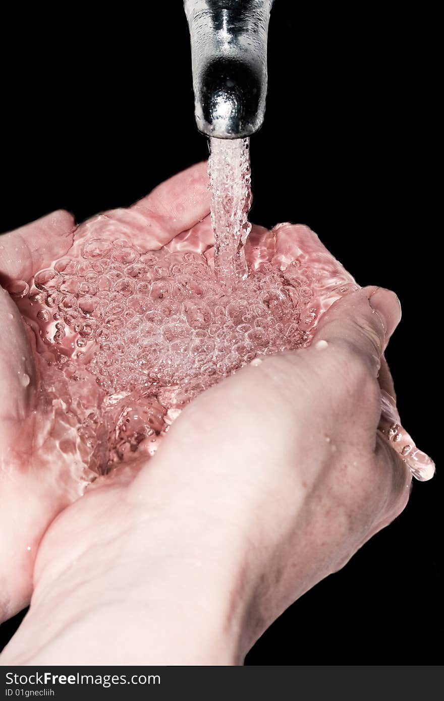 Hands cupping water