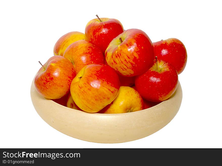 An isolated pottery bowl filled with fresh delicious ripe apples. An isolated pottery bowl filled with fresh delicious ripe apples