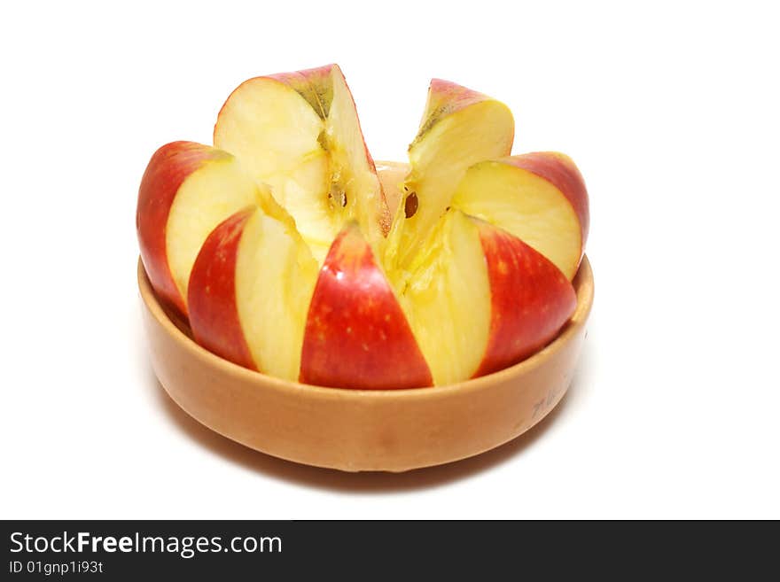 An isolated pottery bowl filled with fresh delicious ripe apples. An isolated pottery bowl filled with fresh delicious ripe apples