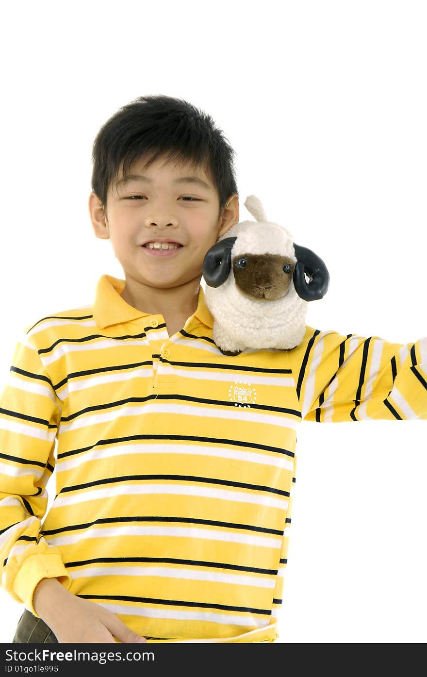 Happy boy cuddling a soft toy sheep. Happy boy cuddling a soft toy sheep