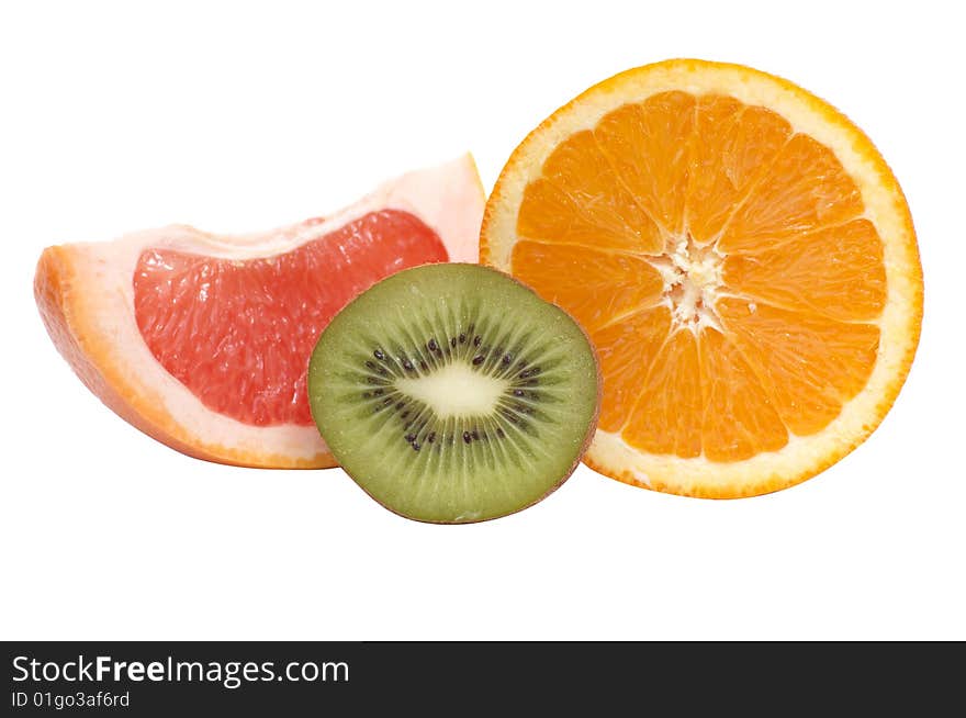 Ripe,juice segments of kiwi,orange and grapefruit isolated on a white background. Ripe,juice segments of kiwi,orange and grapefruit isolated on a white background.