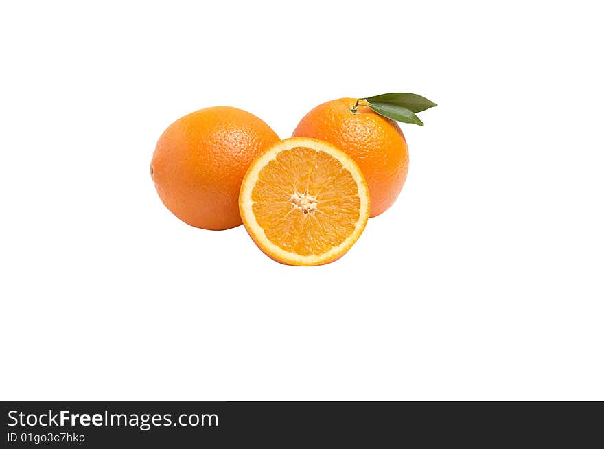 Juicy oranges with green leaves  isolated on a white. Juicy oranges with green leaves  isolated on a white.