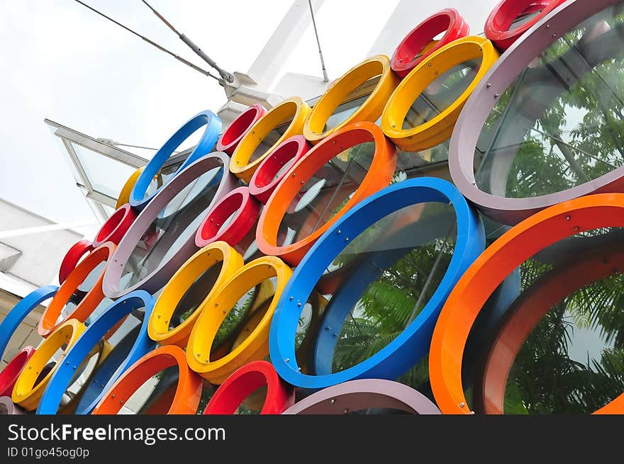 Colorful circular rings on a glass wall