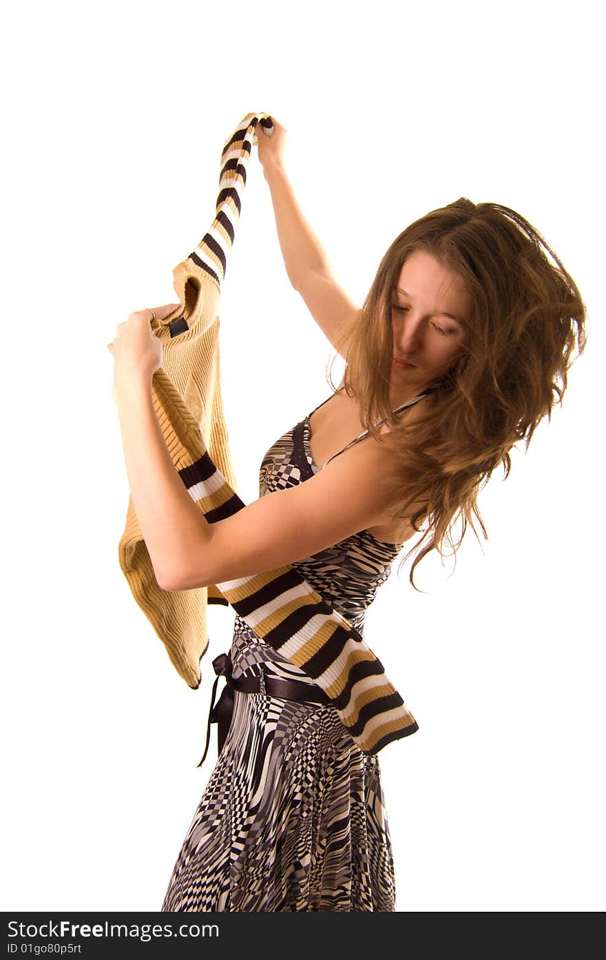 Young woman dancing with sweater