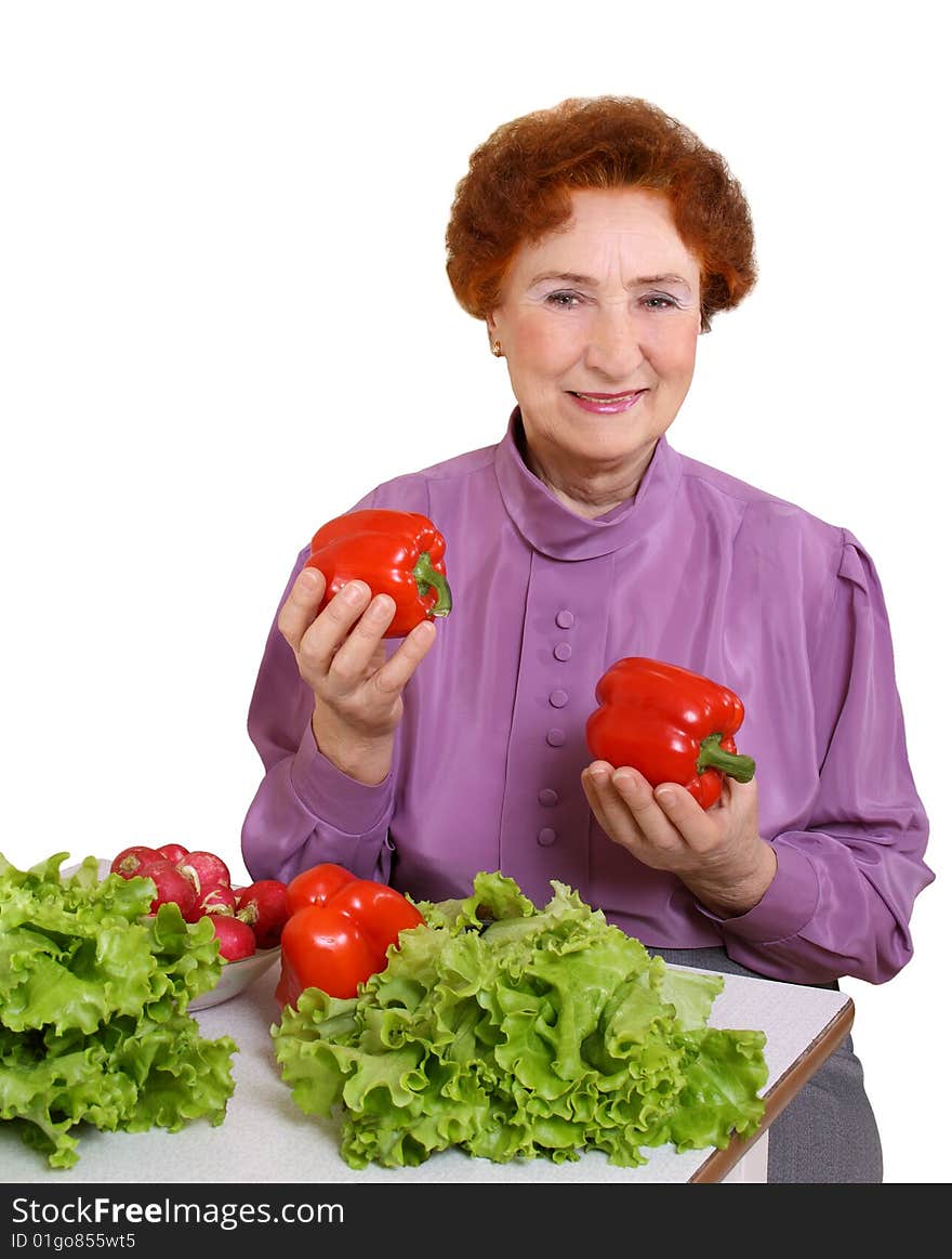 The woman with fresh vegetables on a white background. The woman with fresh vegetables on a white background