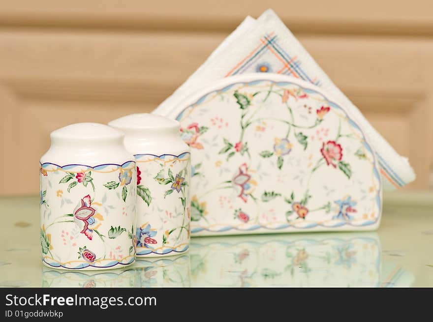 Salt & Pepper Shaker with paper napkins on the table