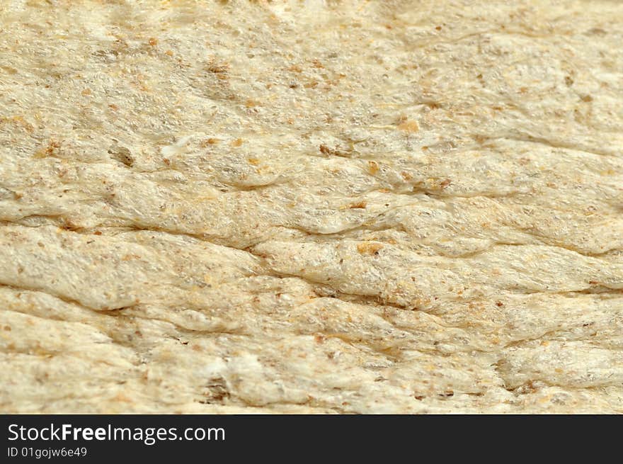 Macro shooting of a surface of a slice of bread. Macro shooting of a surface of a slice of bread.