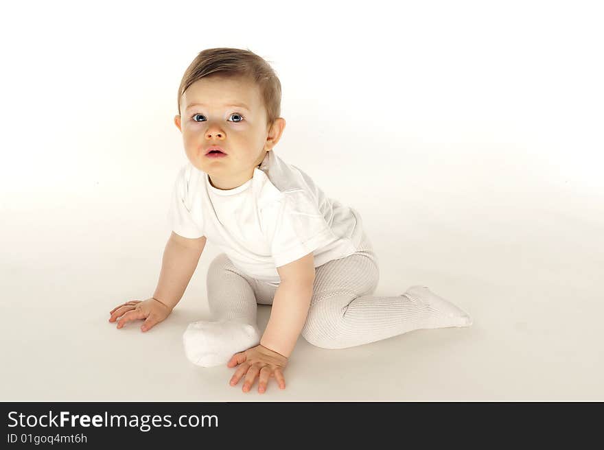 Cute Little Baby In White Field