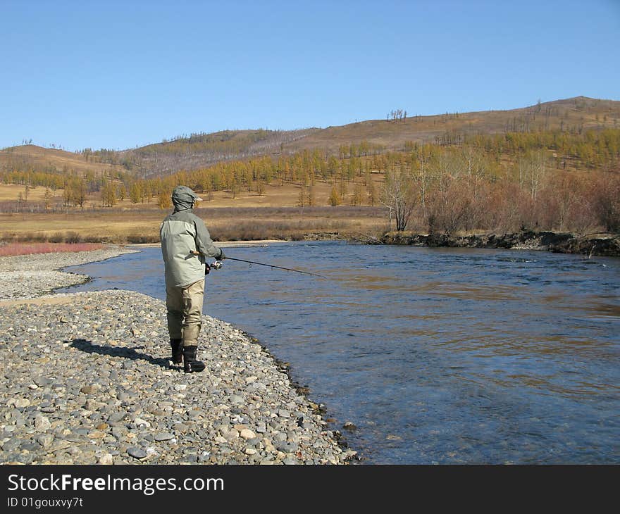 Fisherman catch fishes in wildness. Fisherman catch fishes in wildness