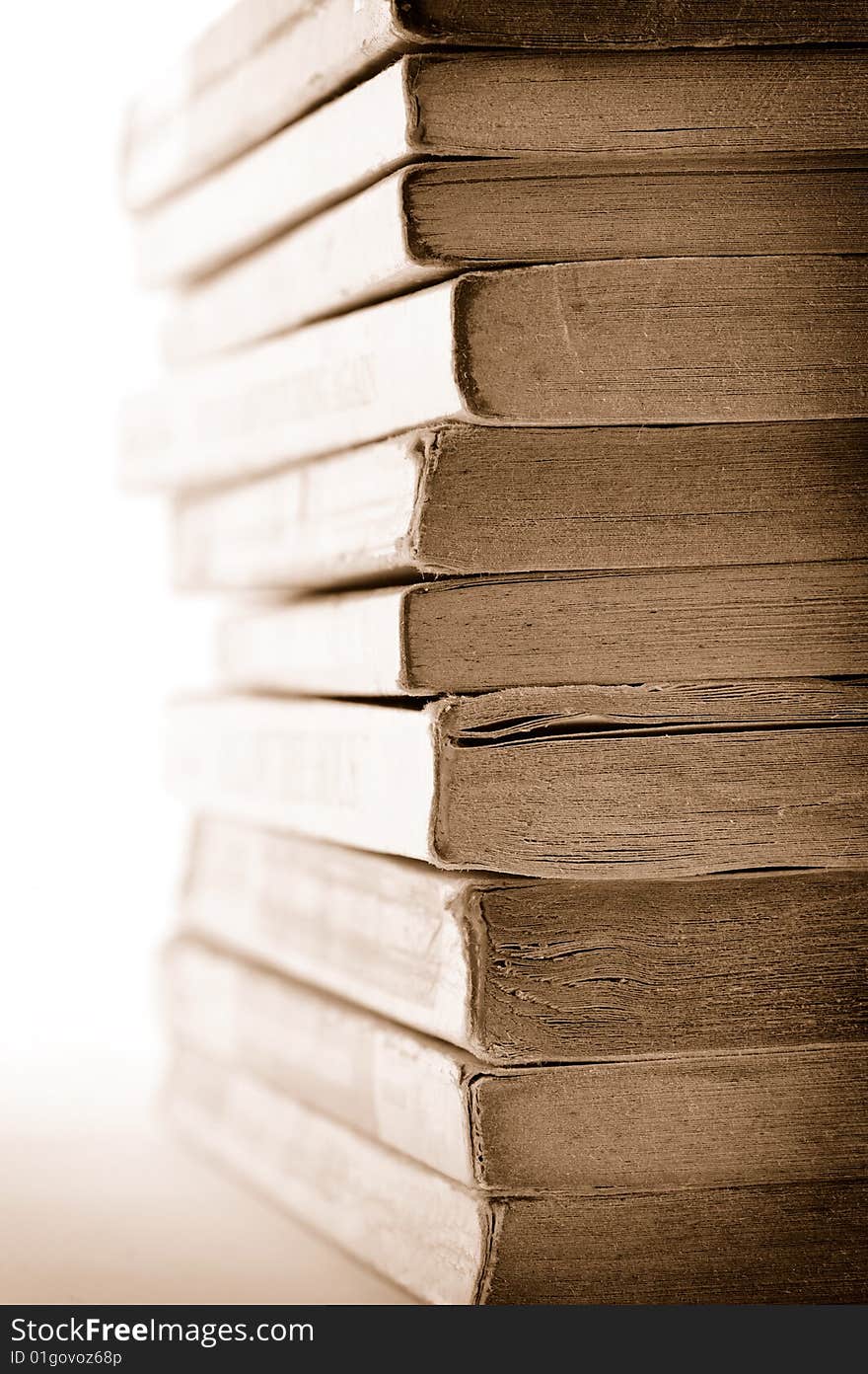 A stack of old books on white background