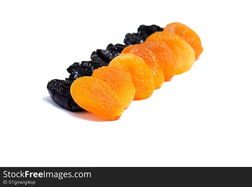 Wonderful dried apricot and prune   on a white .