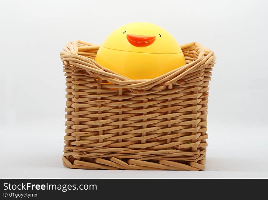 A plastic chicken cup and cane box.