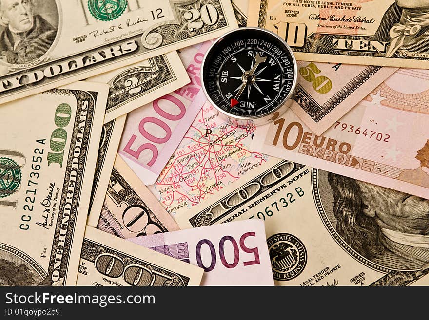 Background from dollars, euro and compass. Background from dollars, euro and compass