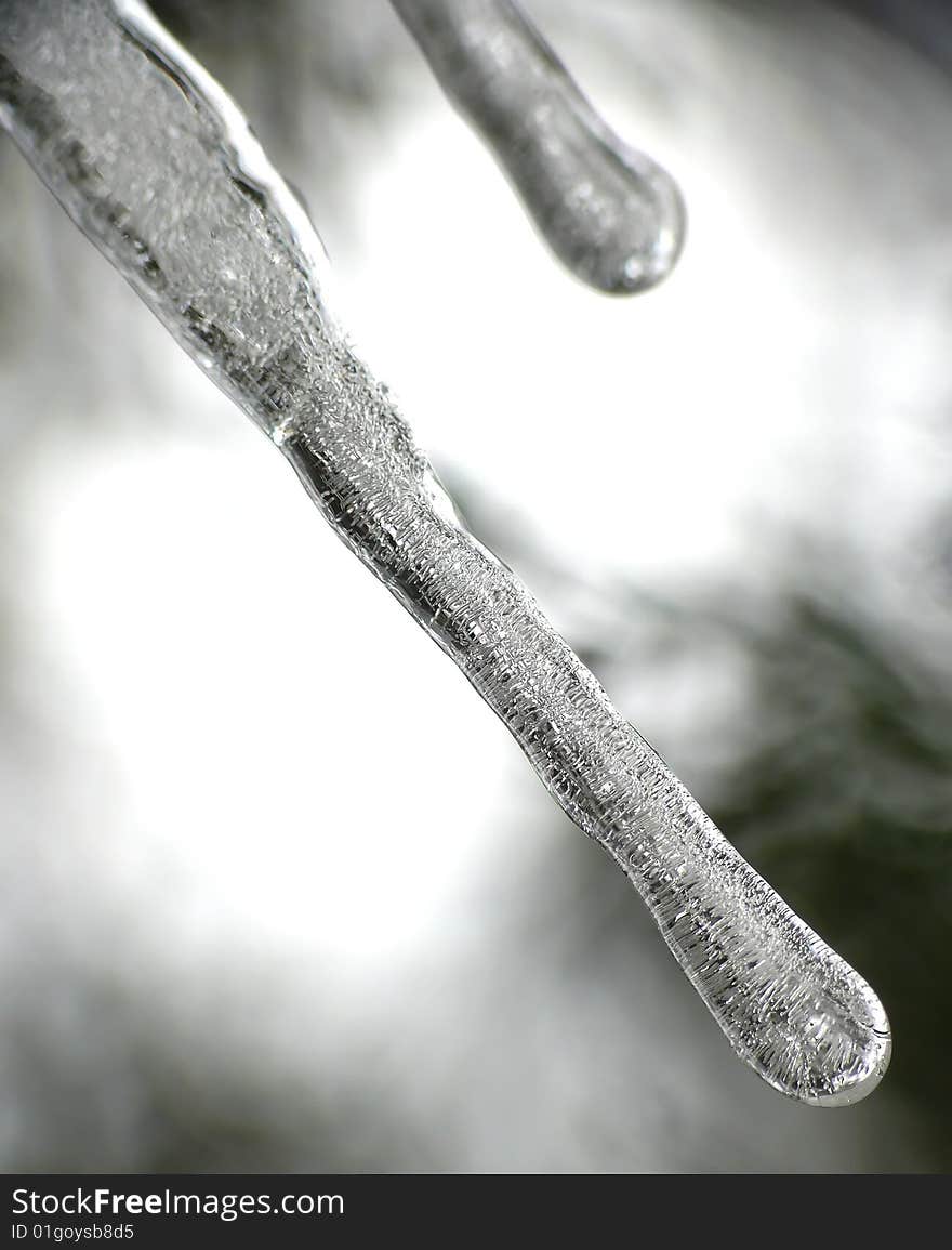 Icicles on black and grey background. Icicles on black and grey background