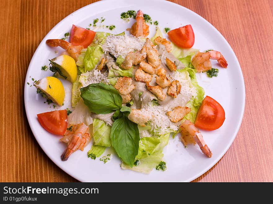 Salad Caesar with seafood and vegetables