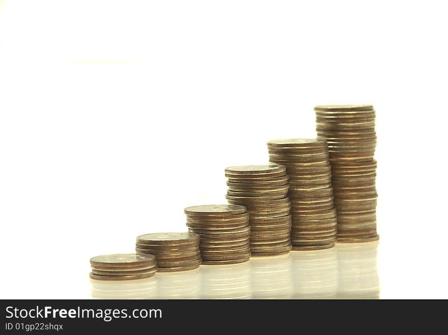 Stacks coins on a white. Isolated. White backround. Stacks coins on a white. Isolated. White backround