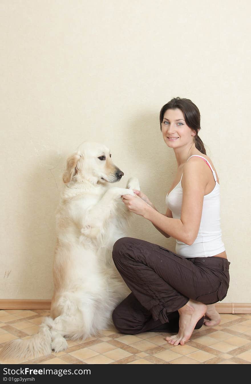 Girl plays with her dog labrador. Girl plays with her dog labrador