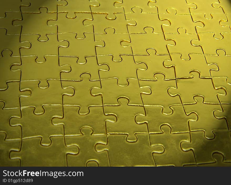 Background of gold jigsaw puzzle