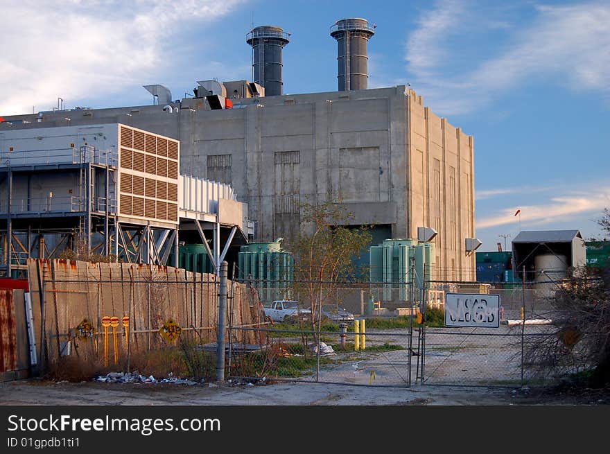 An old coal fired power plant in an industrial section of the Port of Los Angeles. An old coal fired power plant in an industrial section of the Port of Los Angeles.