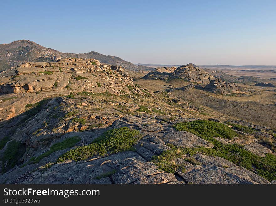 Mountain with rocks under blue sky. Mountain with rocks under blue sky