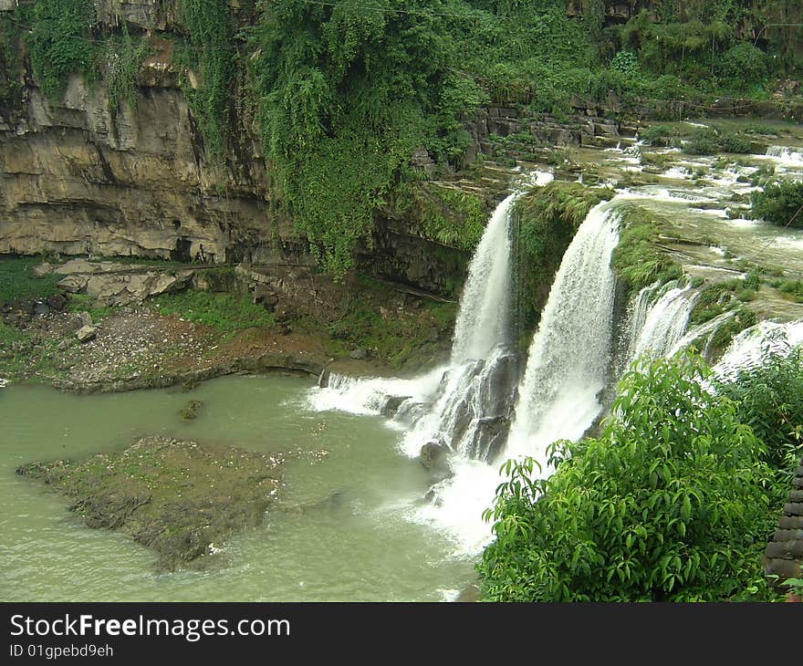 Summer river waterfalls formed together