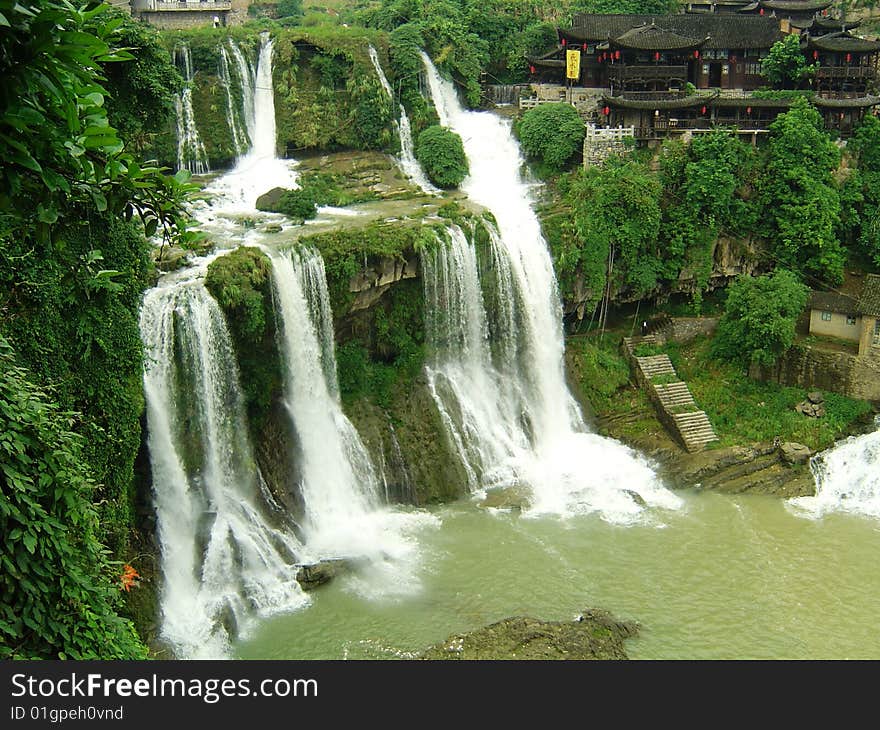 Summer river waterfalls formed together