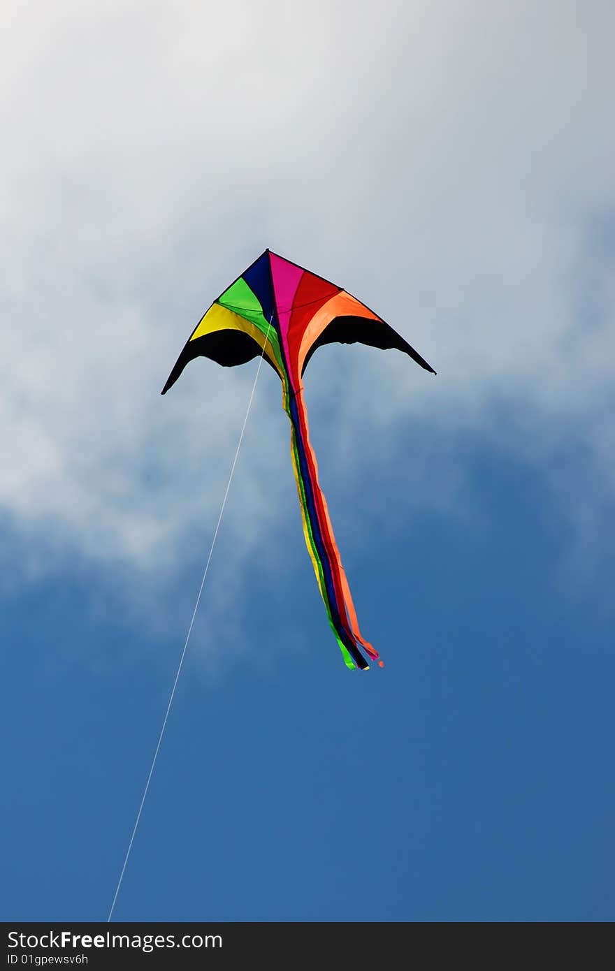 Colored kite in blue sky. Colored kite in blue sky