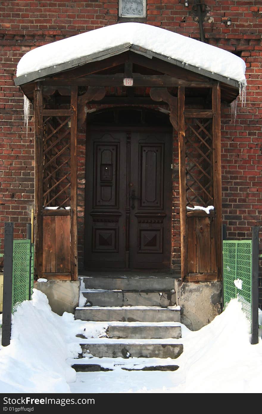Old doors in winter time in Poland
