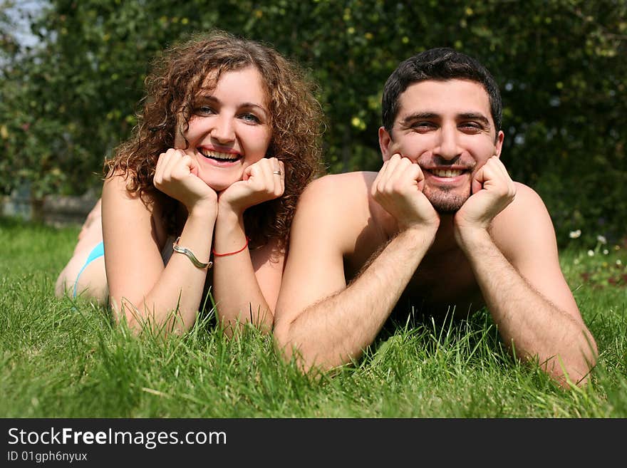 Romantic couple outdoors in green grass