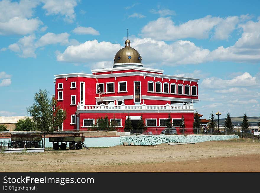 The next red building of blue sky and white cloud